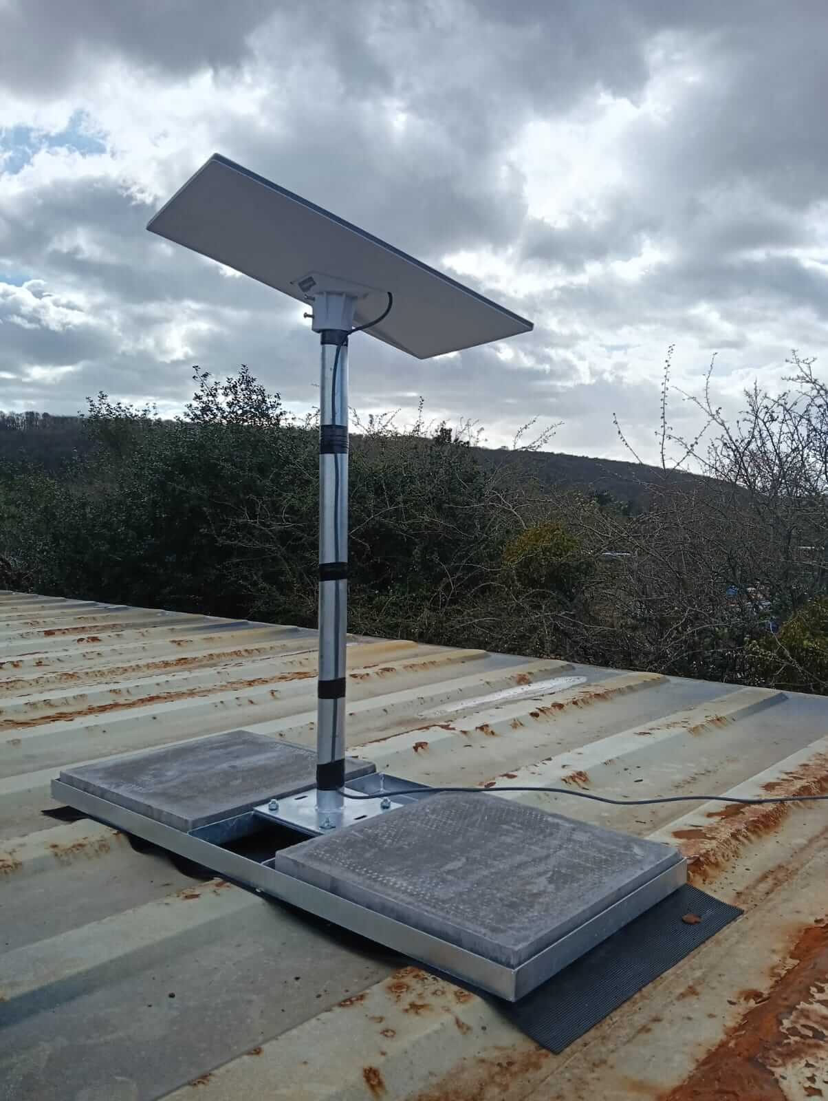 Starlink Gen 3 on flat roof non-penetrating mount on site office container in Bristol