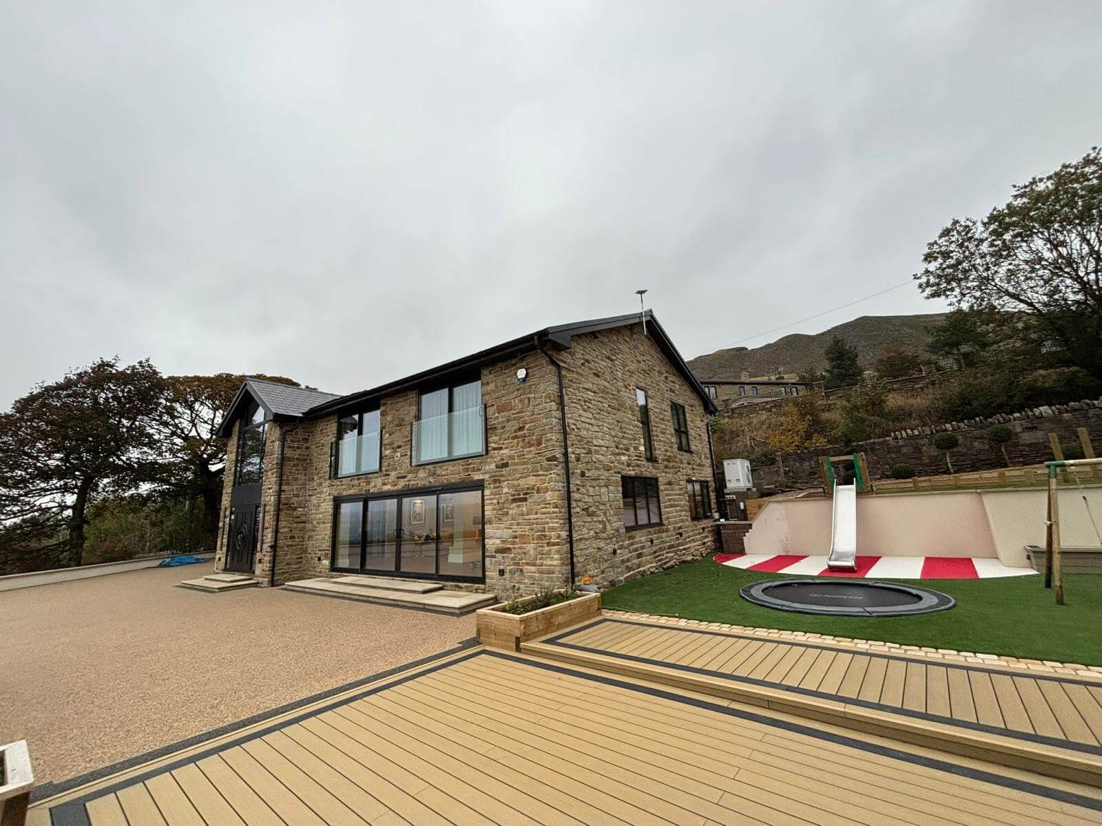 Professional Starlink installation in Ramsbottom - Modern stone home with roof-mounted dish
